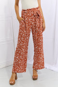 Geometric Print Paperbag Pants in Orange-Red – front view, tie waist wide-leg silhouette